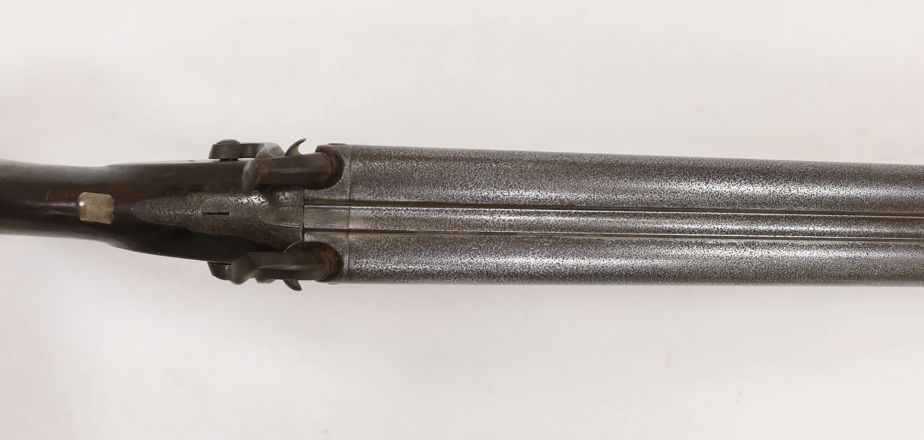 A double barrel, percussion sporting gun by F.T. Baker, half stocked, locks engraved with gundogs, iron mounts, barrels 74cm